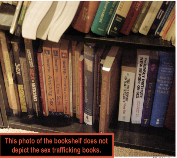 FBI search photo — the bookshelf shown in the photo immediately prior, no sex-trafficking books visible (IMAGE TO BE ADDED)